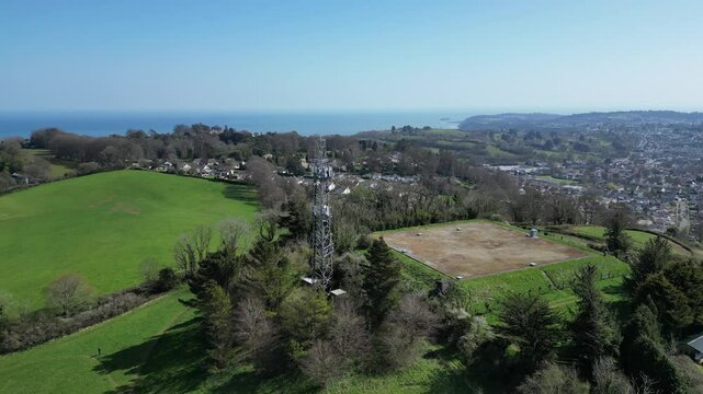 Torquay, Torbay, South Devon, England: DRONE VIEWS: Circling shots of a mobile network transmitter on Great Hill, Watcombe. Torbay is a popular UK holiday destination (Clip 8).