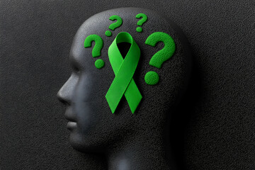A silhouette of a head with a green ribbon and question marks, symbolizing mental health awareness and the importance of understanding.