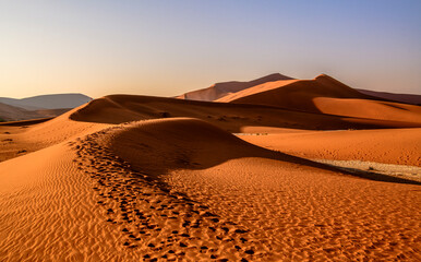 Interesting interplay of curvy dune structures and shadows, Africa