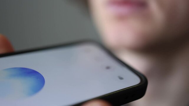Vertical screen artificial intelligence answers instantly as user asks questions through voice input phone screen lights up smooth fast reliable flow of information with cutting edge AI feedback