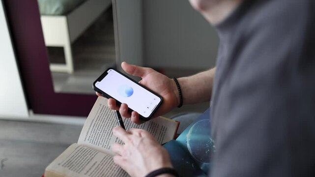 Learning with ChatGPT phone in hand open science book on lap pen ready to take notes focused calm vibe modern way of studying blends AI help with traditional reading and curiosity