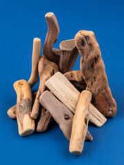 Close up wooden   driftwood for aquarium and crafts on blue background