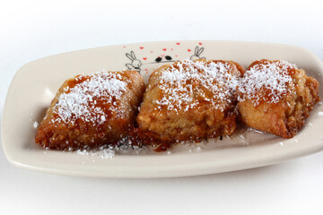 syrup dessert with coconut on top