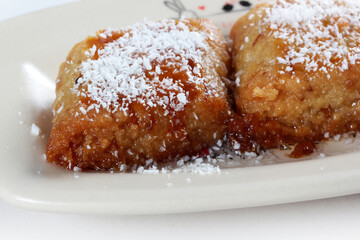 syrup dessert with coconut on top