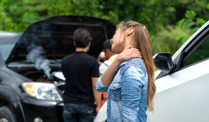asian woman hurt neck car accident waiting for insurance checking. injured woman holding neck walking in accident scene area. asian woman in pain with company agent checking motor from car collision