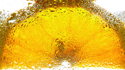 Orange slice close-up seen through glass with water droplets, macro photography style, bright white...