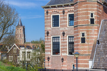 Historic Tolhuis building and church tower in Gorinchem, Netherlands