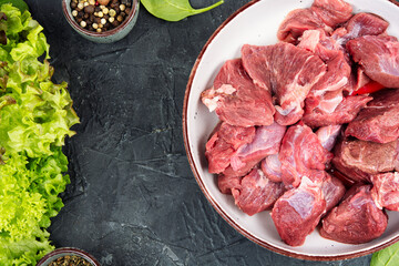 Raw deer venison prepared for a cooking process.