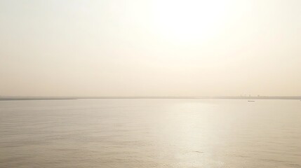 Fototapeta premium Calm sea sunrise with hazy horizon.