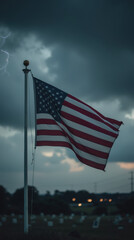 weathered American flag waves against stormy sky, symbolizing resilience and patriotism amidst dark clouds and distant lightning