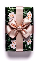elegant gift, wrapped in delicate floral paper and tied with a shimmering rose gold ribbon, exudes a sense of luxury 