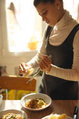 Culinary Art A Talented Woman Cooking a Delicious Gourmet Pasta Dish with Style and Flavor
