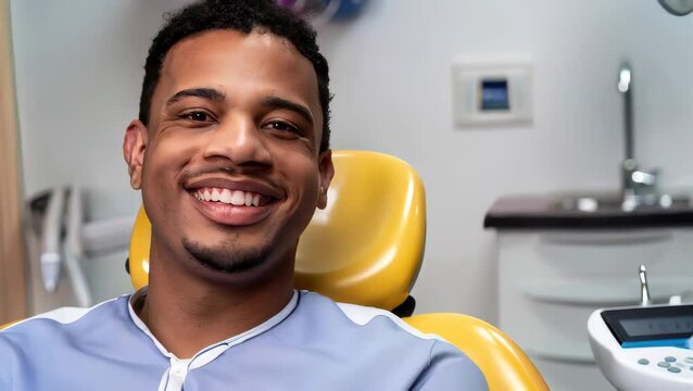 portrait of a young patient sitting on dentist chair of a dental studio