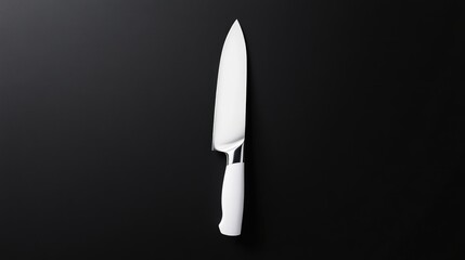 Stainless steel chef's knife on black background