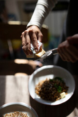 Enhancing the Flavor of a Healthy Meal with Butter in a Cozy and Inviting Kitchen Environment