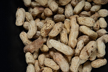 Full frame display of peanuts, salted beans in one frem, a group of peanuts in one frem.
