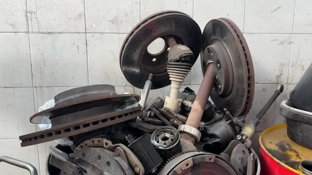 A technician is repairing the shock absorber section of the car.