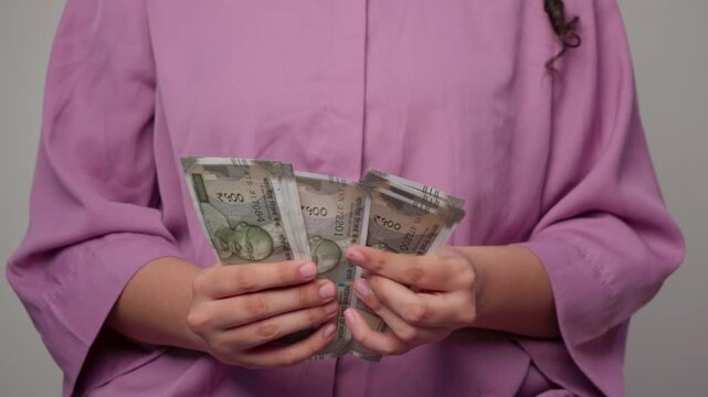 Closeup Of Woman Counting 500 Indian Rupees