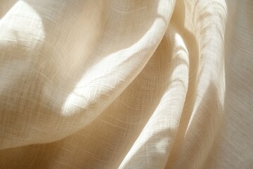 A close up image of soft textured cream colored fabric
