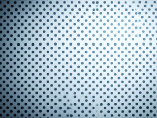 A textured surface with evenly spaced circular perforations, creating a visually striking pattern in shades of blue and white.