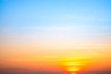 Sky,sunset, beautiful , luxury soft gradient orange gold clouds and sunlight on the blue sky perfect for the background, Sunrise on morning or evening in winter warm time ,Twilight summer,silhouette