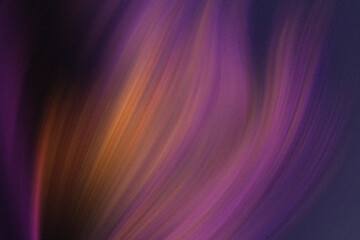 Abstract blurred background featuring a blend of purple orange and black colors creating a soft...