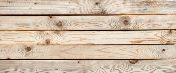 Naklejka premium Weathered driftwood planks showcasing rustic beauty, natural aesthetics