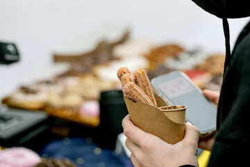 Churros in Paper Cup with Smartphone