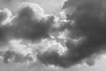Dramatic black and white clouds photographed as high-resolution texture. Idea for background or sky replacement, photo retouching or artistic composities. Can be use as overlay or texture in editing
