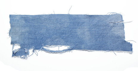 jeans. a frayed and torn piece of denim rag.