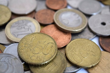 Pile of euro coins. Coins of European countries. Vatican lira, pound sterling, Norwegian krone and Swedish krona and etc.