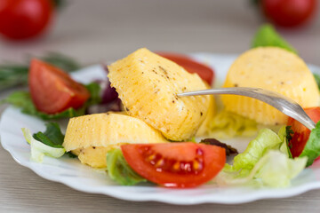 Homemade diet omelette with greens and tomatoes in a cozy atmosphere