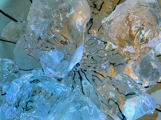Beautiful blue ice close up with black strips on the background