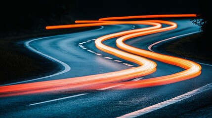 Night road with light trails, and curves.