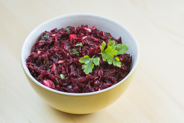 Beetroot salad in a yellow bowl, food providing many health benefits


