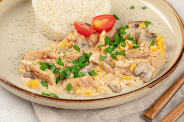 Portion of gourmet chicken fricassee with rice