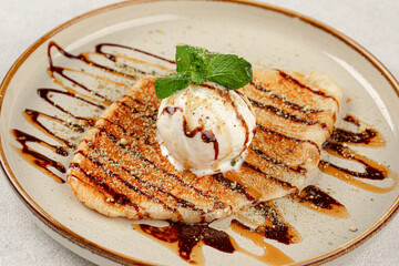 Portion of sweet flat croissant with ice cream