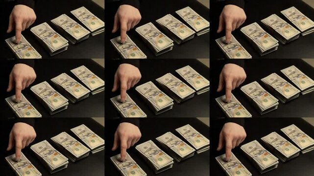 The man counts the money in piles. Concept of thrift, saving, making money