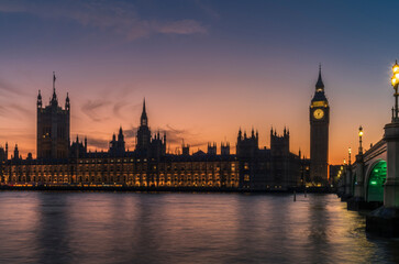 Fototapeta premium A long exposure of the Big Ben tower and the Palace of Westminster during a colorful sunset
