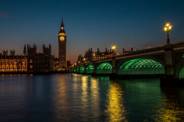 Fototapeta premium A long exposure of the Big Ben tower and the Palace of Westminster during a colorful sunset