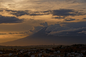 Popocatepetl and Iztaccíhuatl volcanic landscape with fluffy clouds. Izta-Popo Zoquiapan National Park