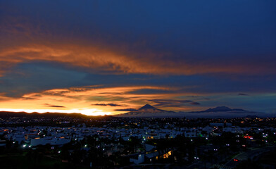Popocatepetl and Iztaccíhuatl volcanic landscape with fluffy clouds. Izta-Popo Zoquiapan National Park