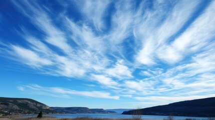 Fototapeta premium Panoramic vista with a captivating blue sky adorned with feathery cirrus clouds
