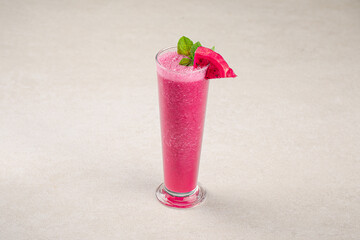 Glass of fresh dragon fruit pitahaya smoothie with mint