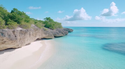 Fototapeta premium A pristine beach with white sand meets turquoise water. Rocky cliffs, topped with lush green vegetation, form a natural border. The scene is bright and sunny, showcasing a high-quality image. The ca