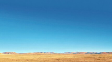 Fototapeta premium Expansive dryland landscape with blue sky stretches to distant hills