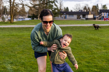 Fototapeta premium Mother and Toddler Enjoying Outdoor Playtime in Burnaby, Vancouver, BC, Canada