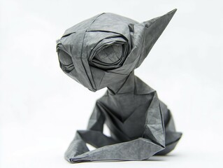 Detailed grey origami figure depicts a fictional character in a seated position, emphasizing craft