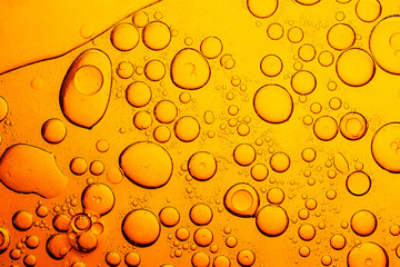 Macro yellow bubble texture,Processed collage of golden yellow oil bubble texture. Background for...