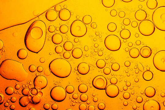 Macro yellow bubble texture,Processed collage of golden yellow oil bubble texture. Background for banner, backdrop or surface.